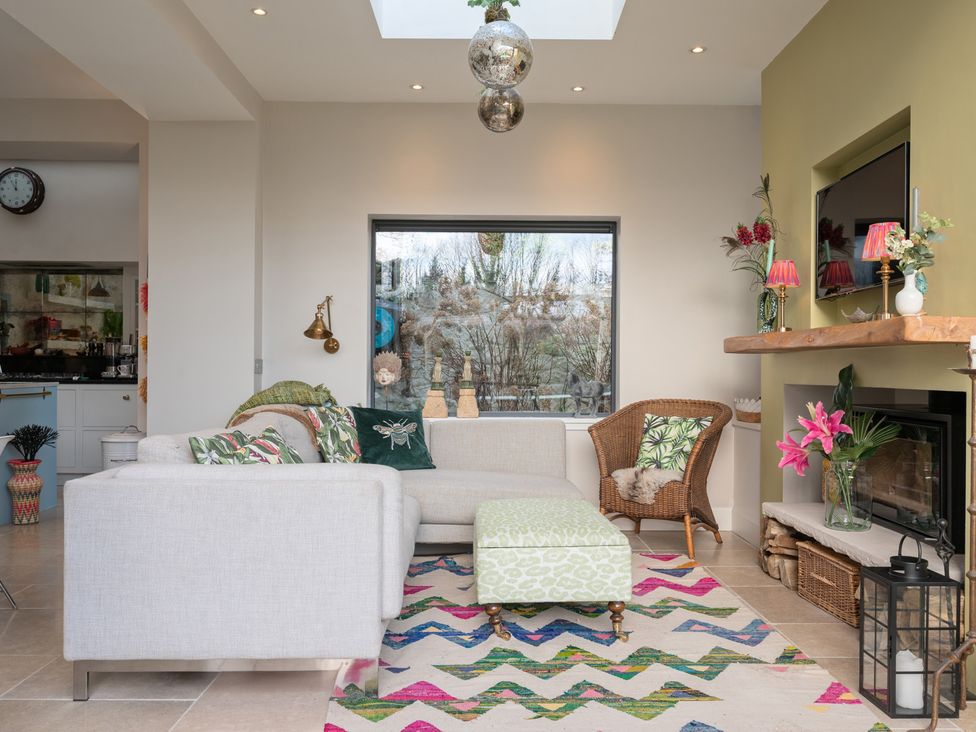 A living room with a sofa and television at a property in an unspecified location