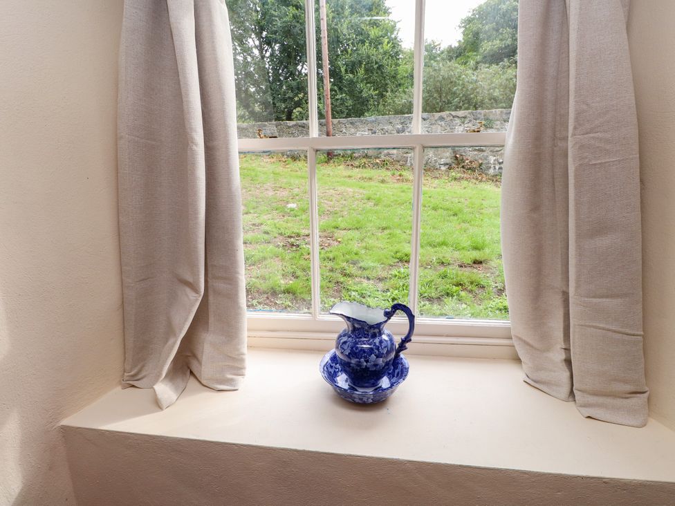 A window with a pitcher on the sill at Felin Bach in Aberdaron