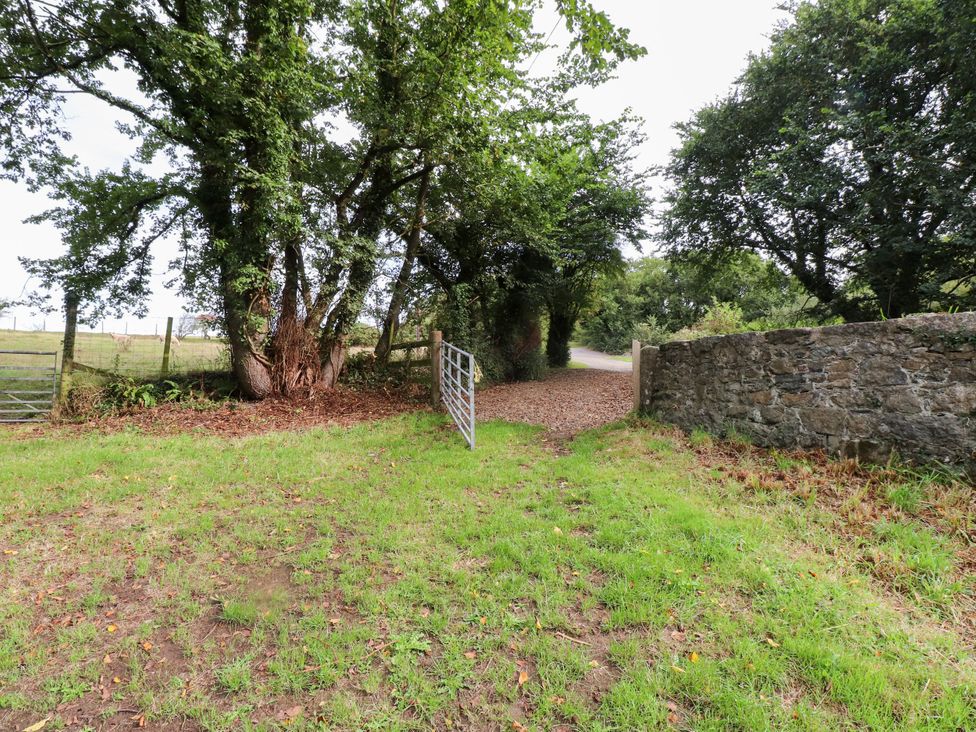 A path with a gate and trees at Felin Bach in Aberdaron