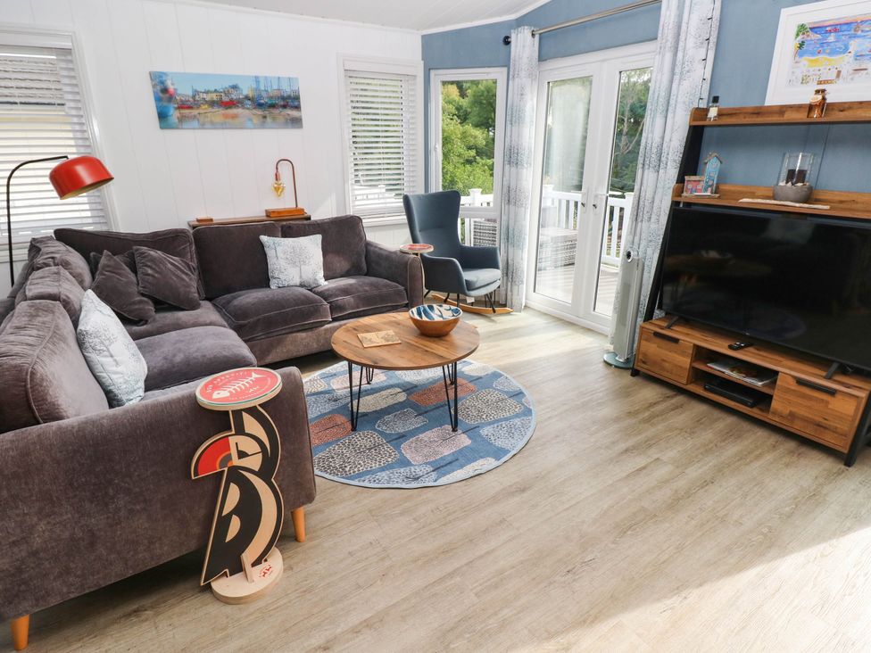A living room with a sofa and coffee table at Pleasant Valley Holiday Lodge 70 Stepaside