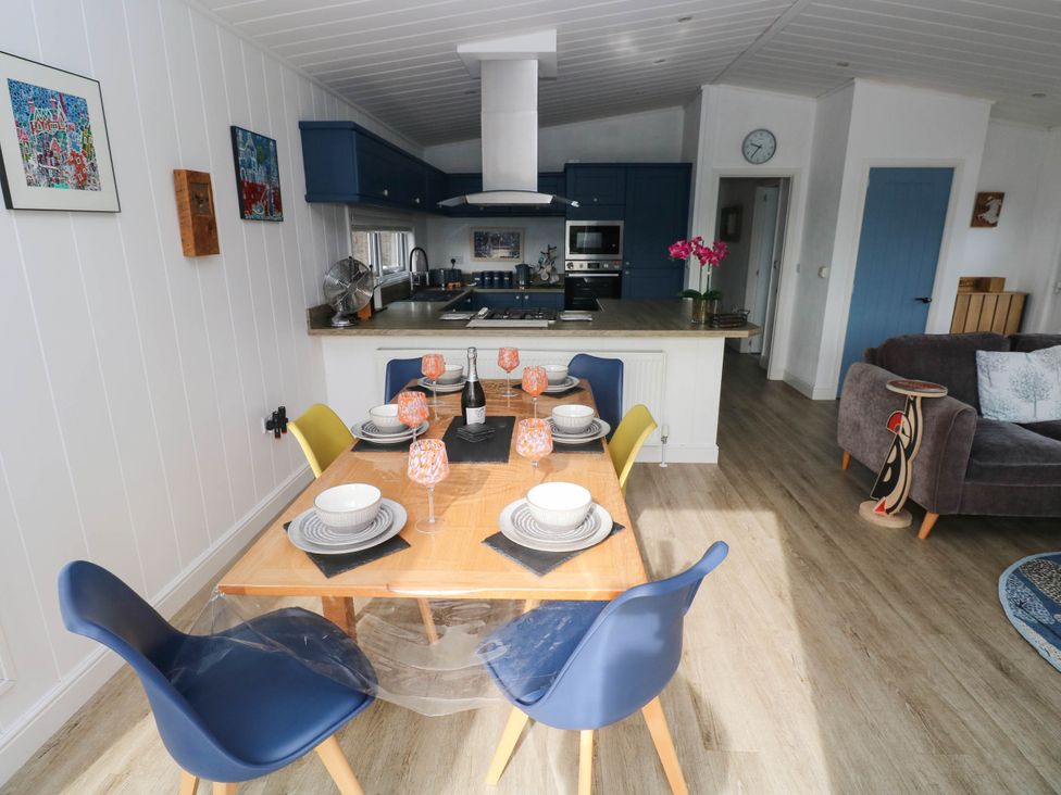A dining area with a table and chairs at Pleasant Valley Holiday Lodge 70, Stepaside