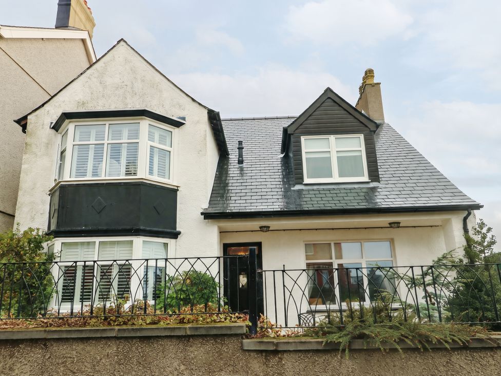 A house with varied windows and a front door at 11 Bryn Goleu Avenue North Holyhead