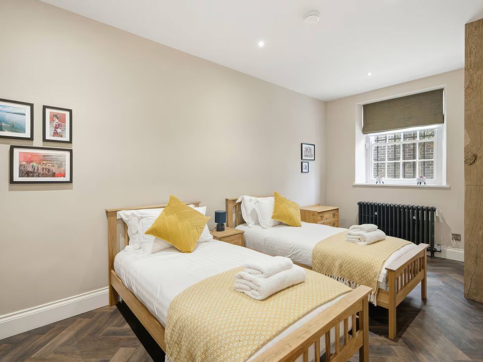 A bedroom with two single beds and a window at Apt. 2 in York