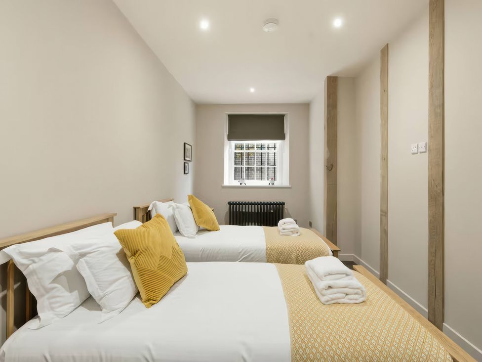 A bedroom with two beds and a window at Apt. 2 in York