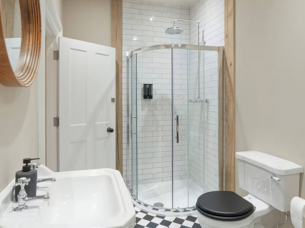 A bathroom with a sink, toilet, and shower at Apt. 2 in York