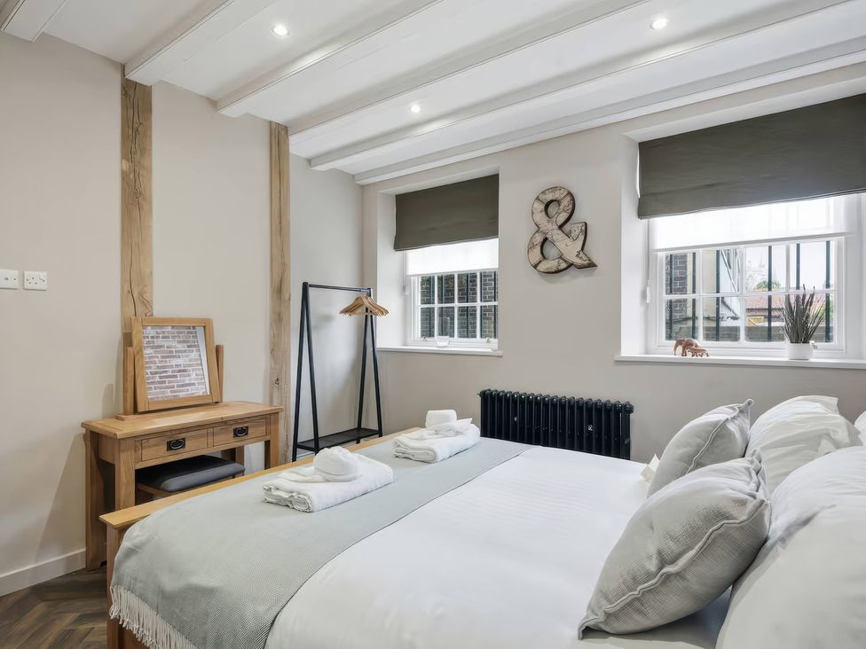A bedroom with a bed and desk at Apt. 2 in York