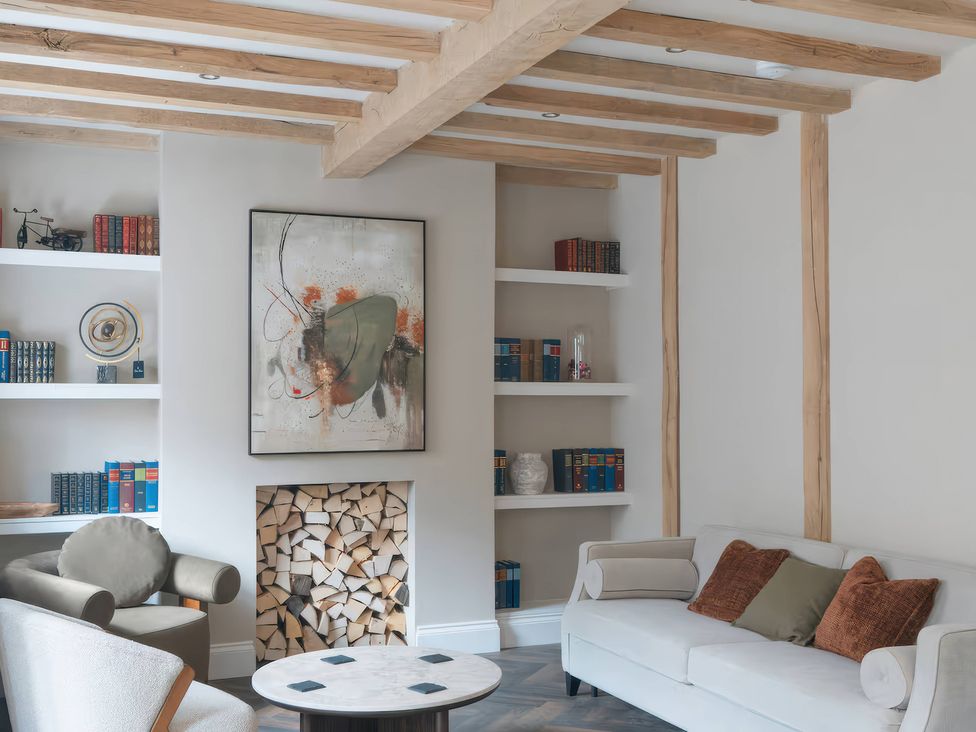 A living room with bookshelves and a coffee table at Apt. 2 in York