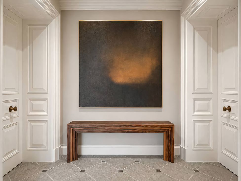 A hallway with a console table and a painting at Apt. 2 in York