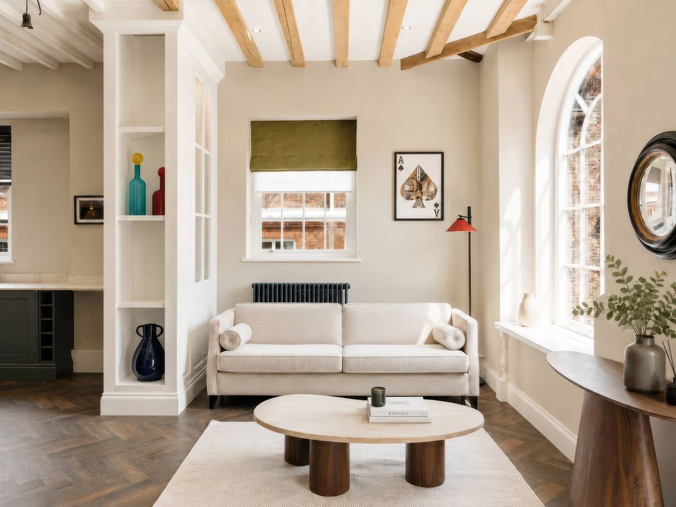 A living room with a sofa and a coffee table at Apt. 3 in York