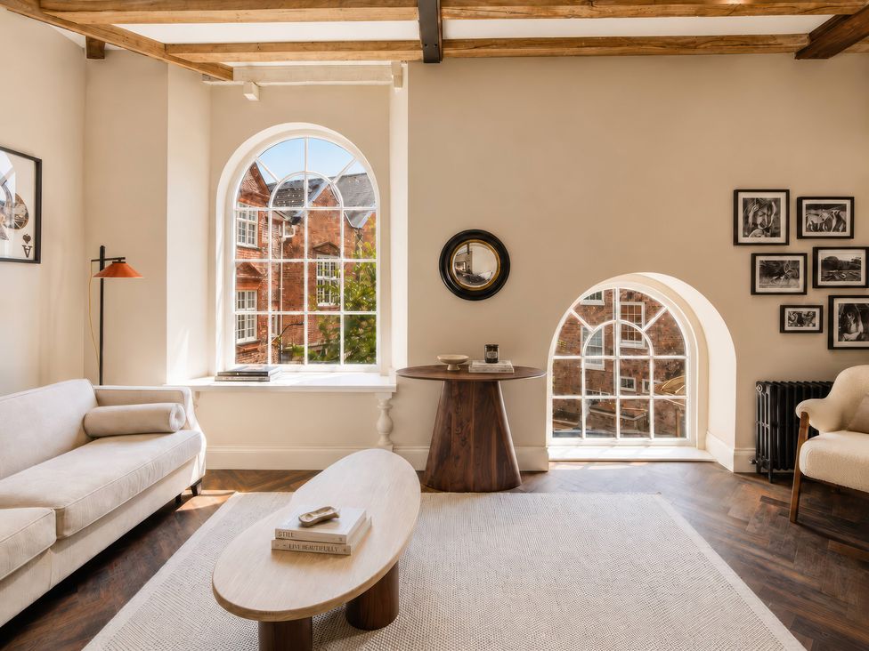 A living room with a sofa and table at Apt. 3 in York