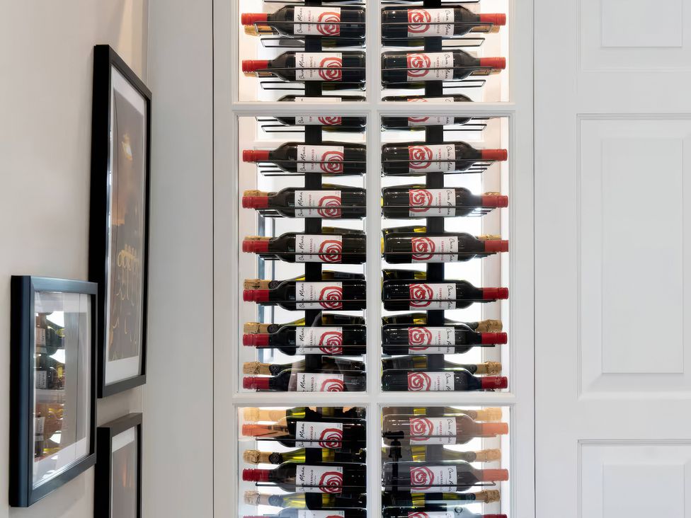 A wine rack displaying wine bottles in Apt. 3 York
