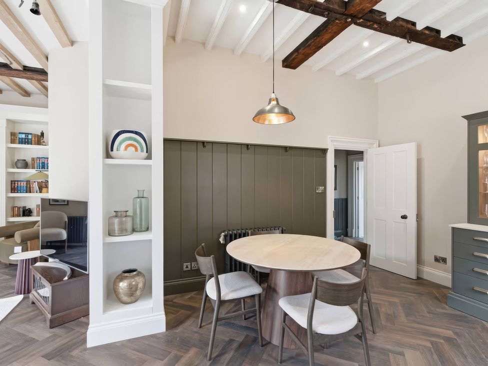 A dining room with a table and chairs at Apt. 3 in York