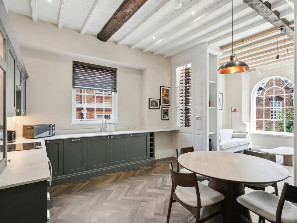 A kitchen with a table and chairs at Apt. 3 in York