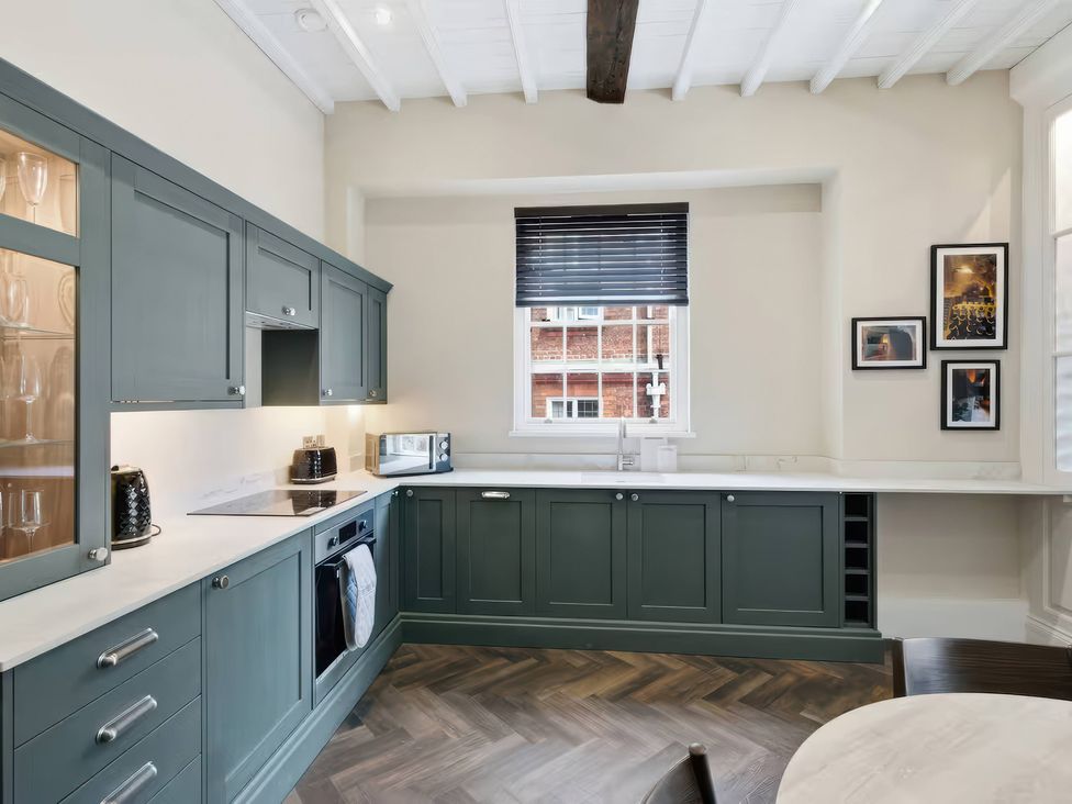 A kitchen with cabinets, countertop, sink, and appliances at Apt. 3 in York