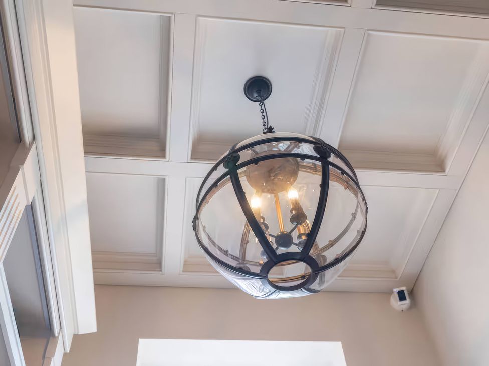 A chandelier hanging from a ceiling at Apt. 3 in York
