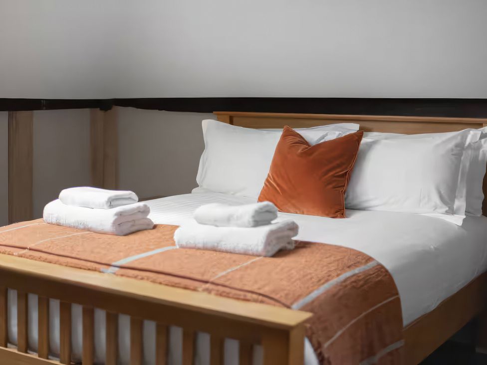 A bedroom with a bed and towels at Apt. 3 in York