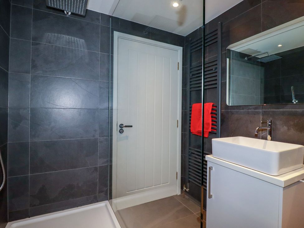 A bathroom with a sink and shower at Mermaid Gaze in Newquay