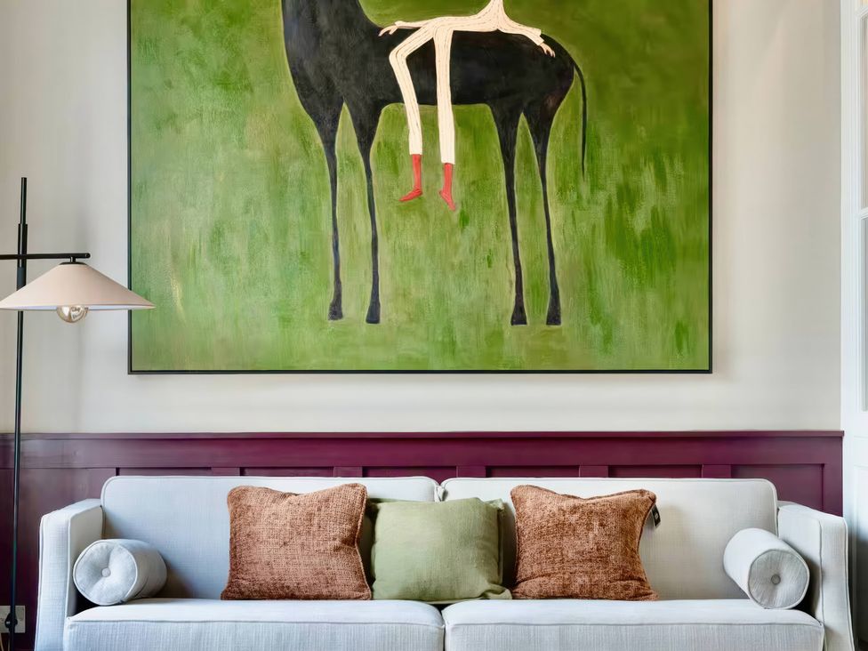 A living room with a painting above a sofa at Apt.4 in York