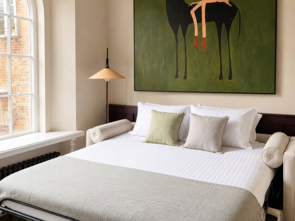 A bedroom with a bed and lamp at Apt.4 York