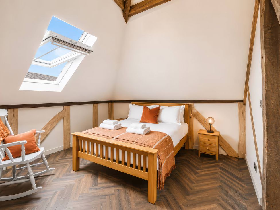 A bedroom with a bed and rocking chair at Apt.4 in York