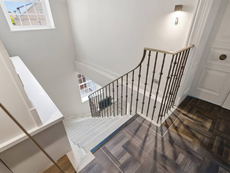 A stairway with a handrail and window at Apt.4 in York