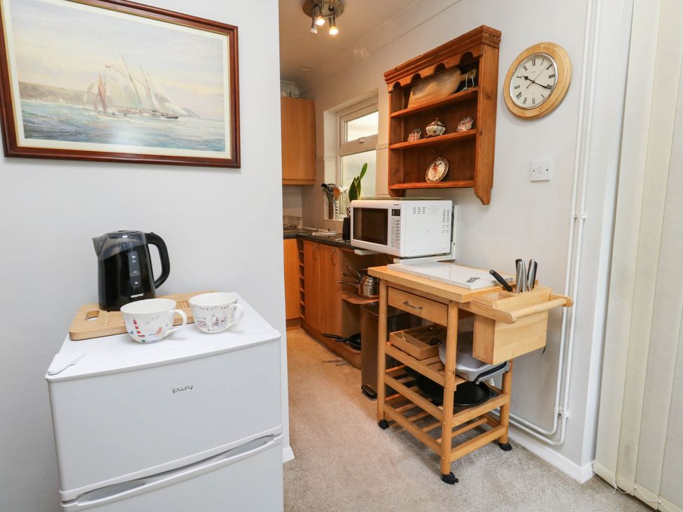 A kitchen with appliances and utensils at Sunnydale near Corfe Mullen