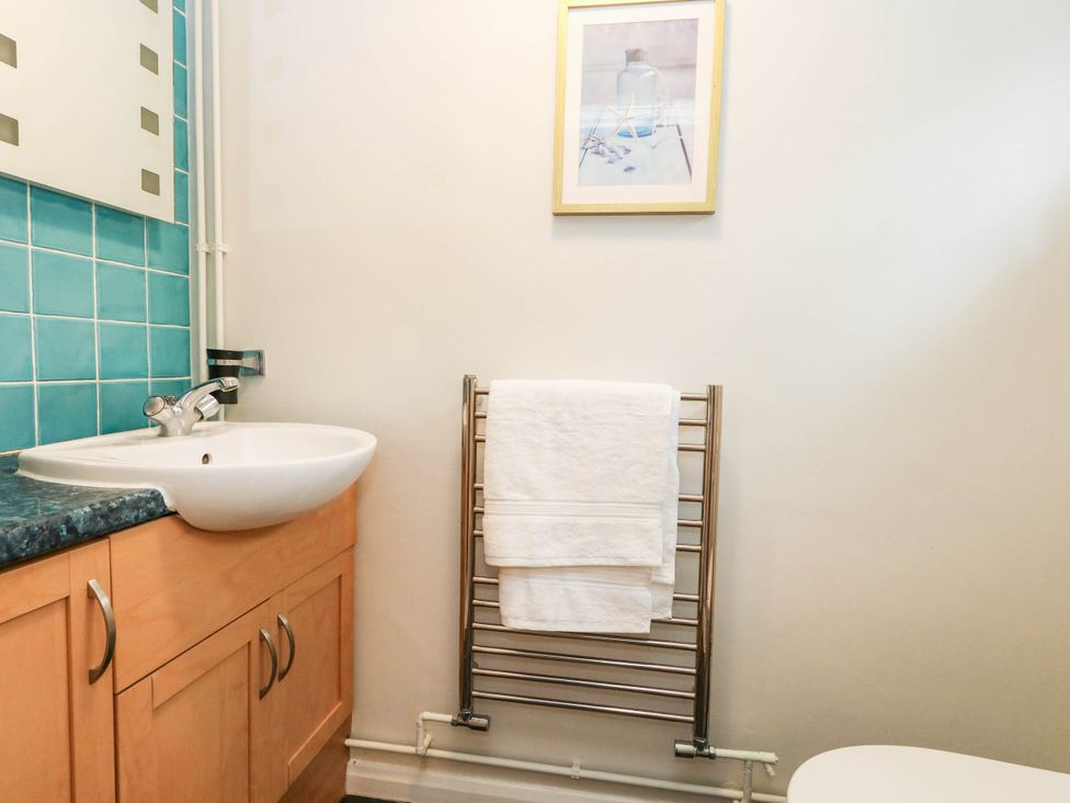 A bathroom with a washbasin and towel rack at Sunnydale near Corfe Mullen