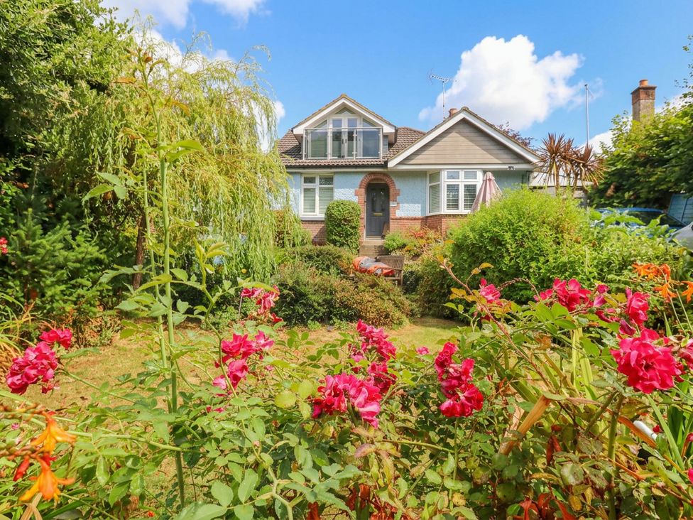 A house with a garden and flowers at Sunnydale near Corfe Mullen