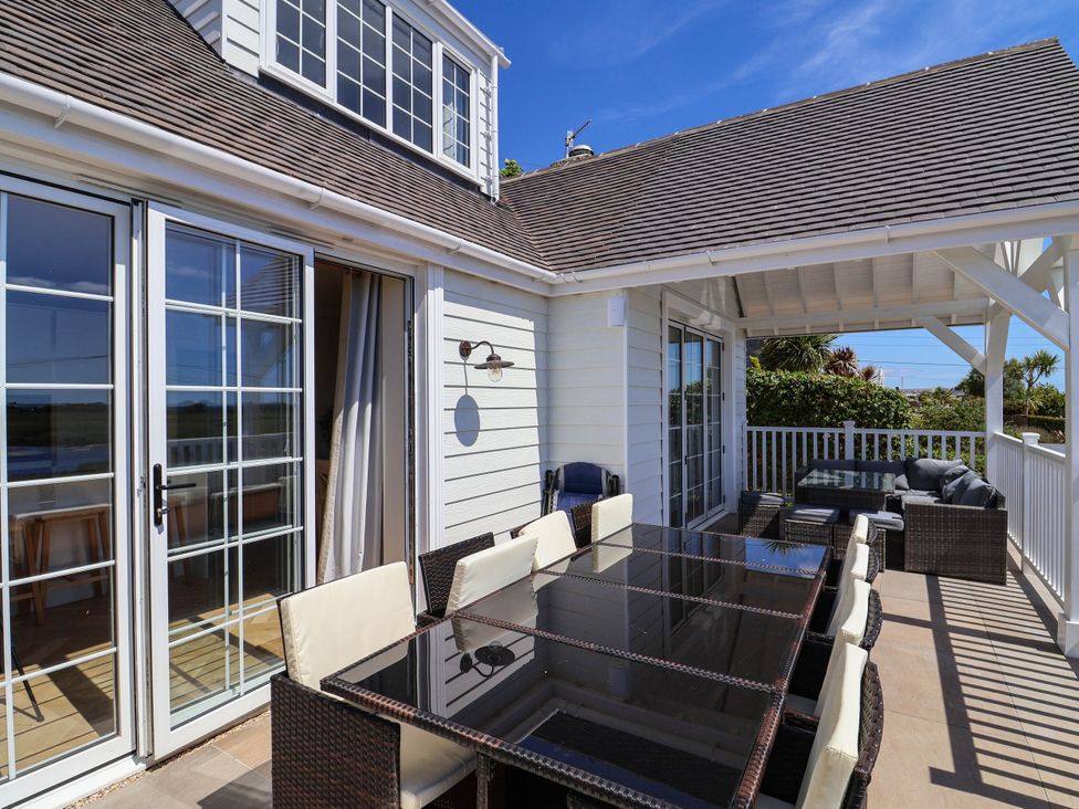 An outdoor seating area with table and chairs at 30 Southdown Avenue Weymouth