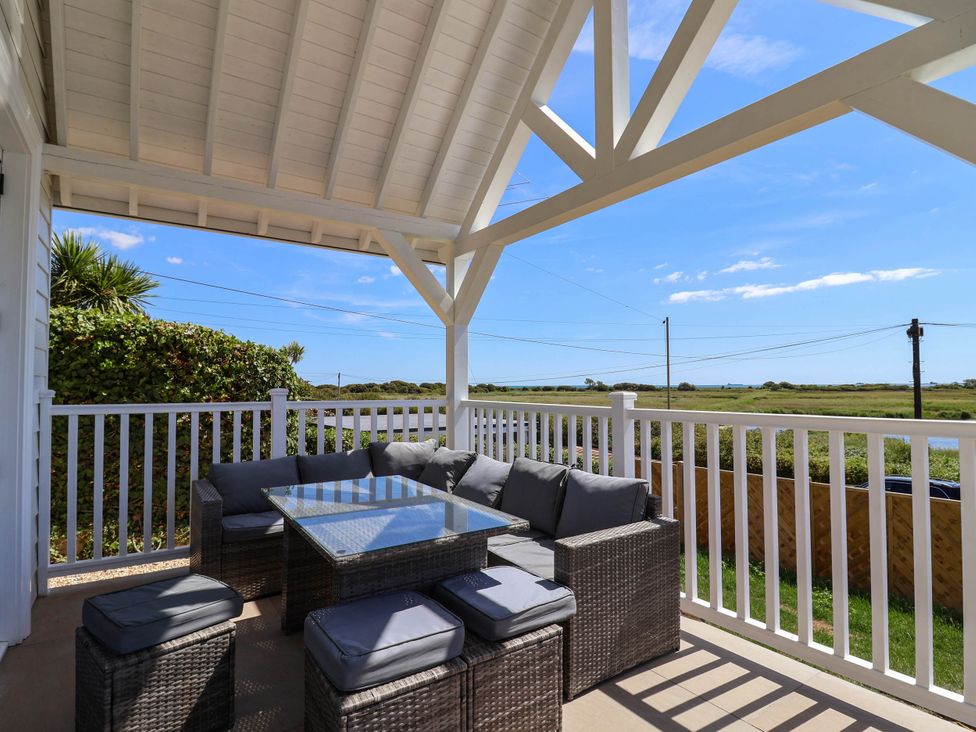 A deck with outdoor furniture and a view of the landscape at 30 Southdown Avenue Weymouth