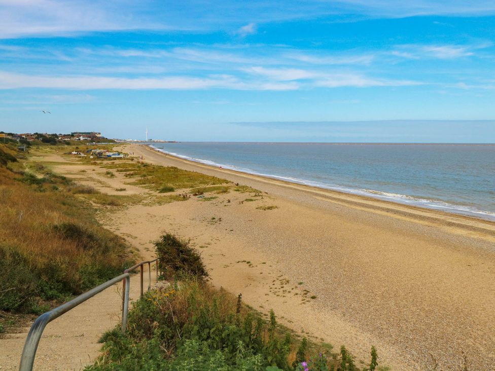 A beach view with sea and sand at The Mill House Apartment in 