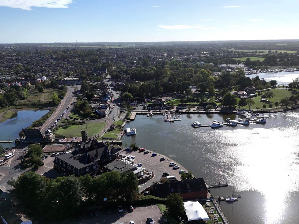 An aerial view of a marina with boats and surrounding area at The Mill House Apartment in Oulton Broad