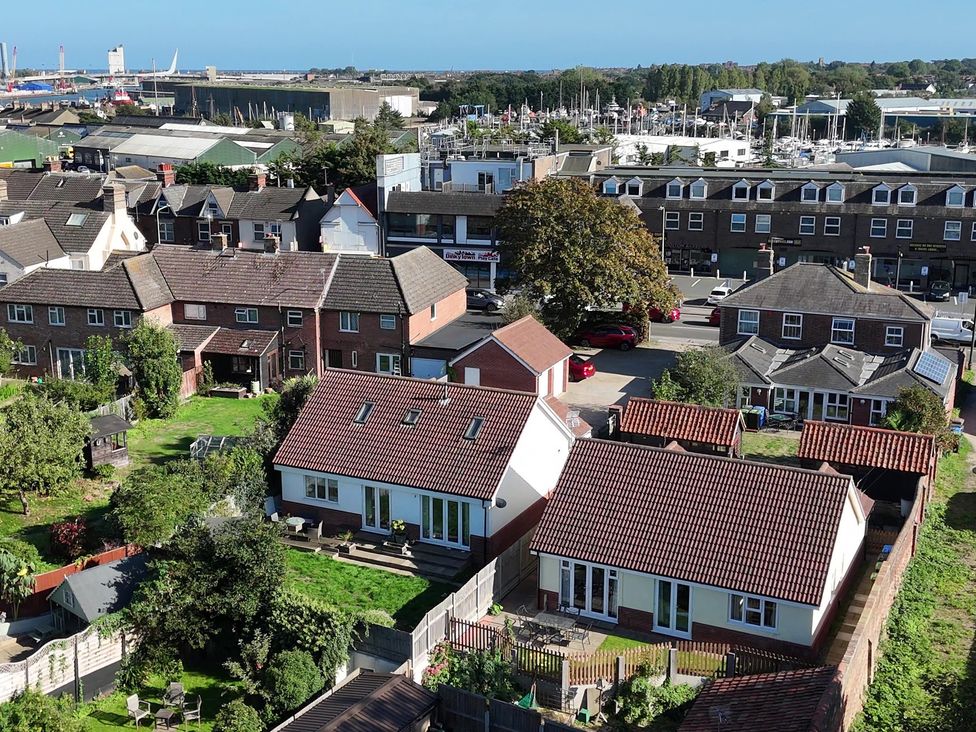 An outdoor area with houses and gardens at The Mill House Apartment Oulton Broad