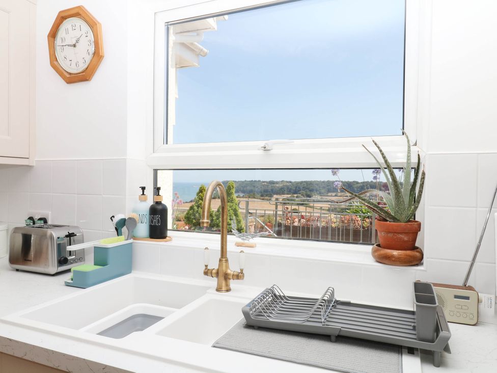 A kitchen with a sink and countertop at Elberry Cove View in Paignton