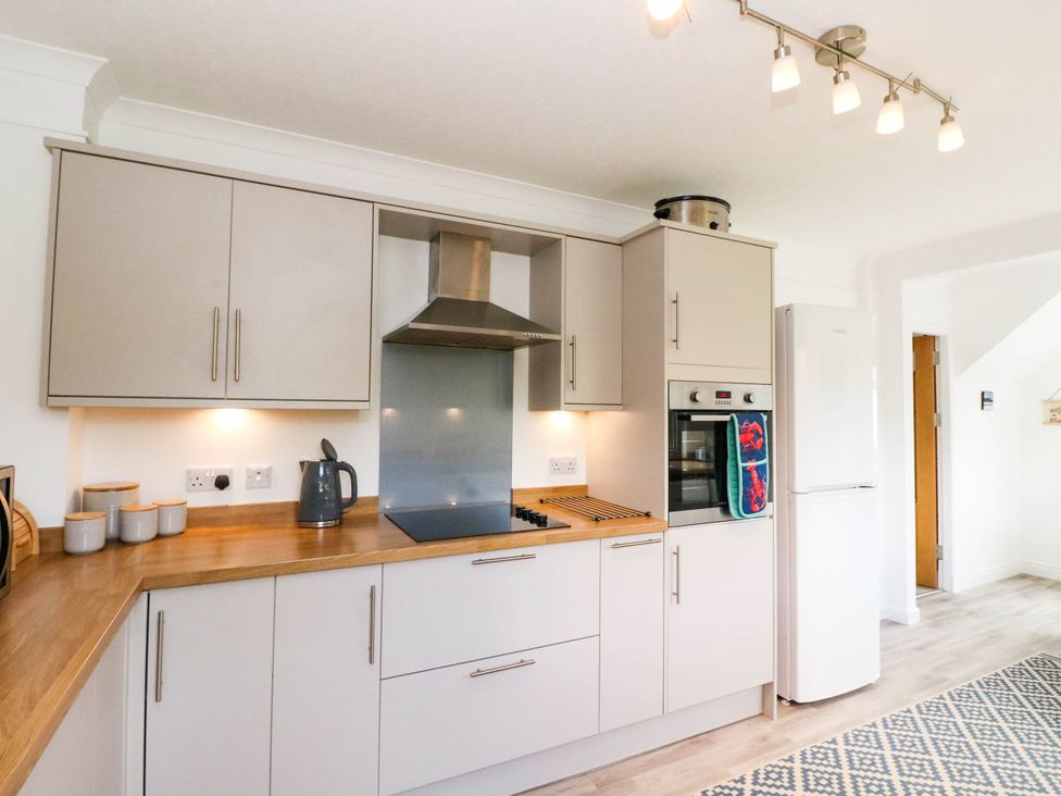 A kitchen with cabinets and a countertop at Skye View in Isle of Harris