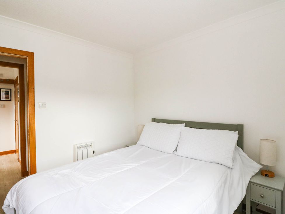 A bedroom with a bed and bedside table at Skye View in Isle of Harris