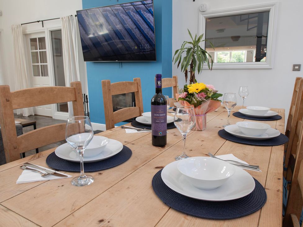 A dining room with a table set for a meal at The Old School House 