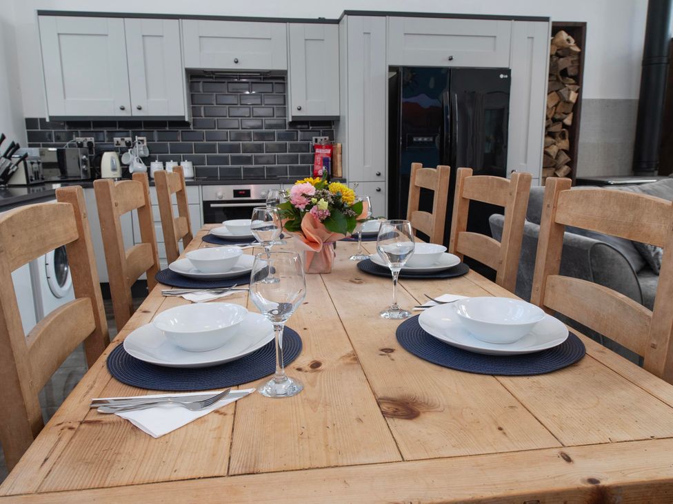 A dining room with a table set for a meal at The Old School House 
