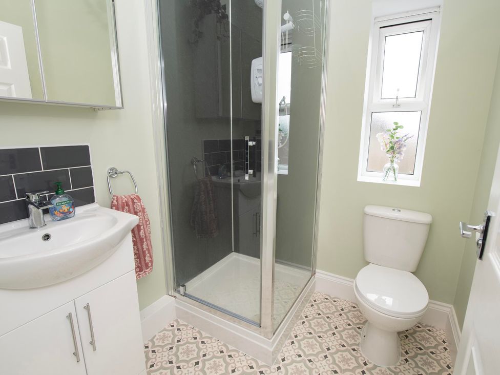 A bathroom with a shower and toilet at The Old School House