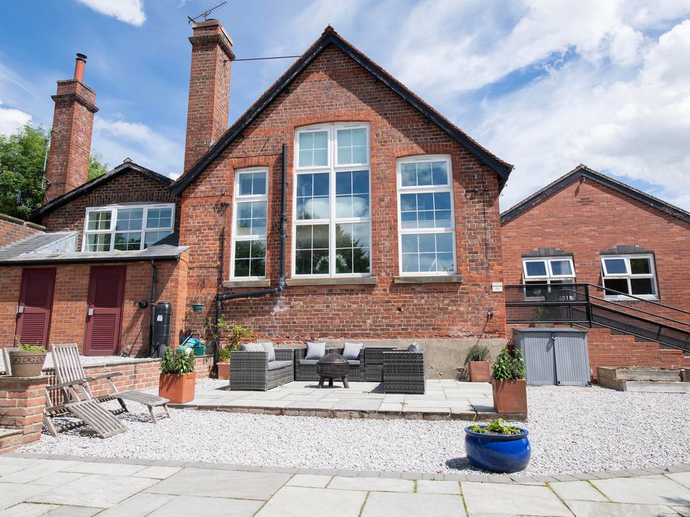 An outdoor seating area with patio furniture at The Old School House