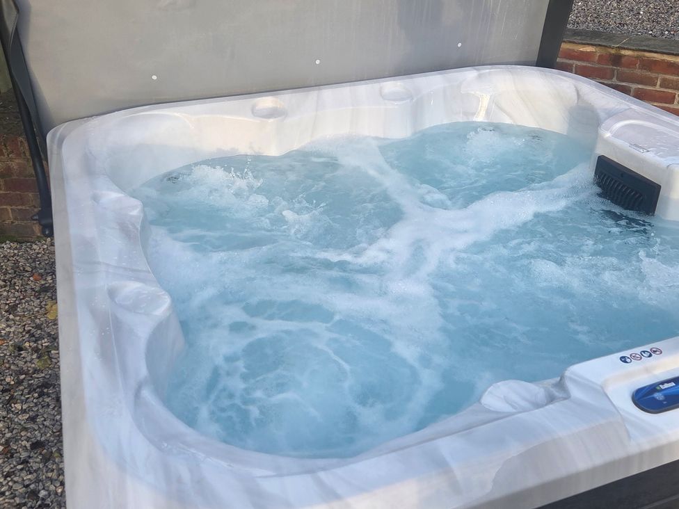 A hot tub filled with water at The Old School House in Langtoft
