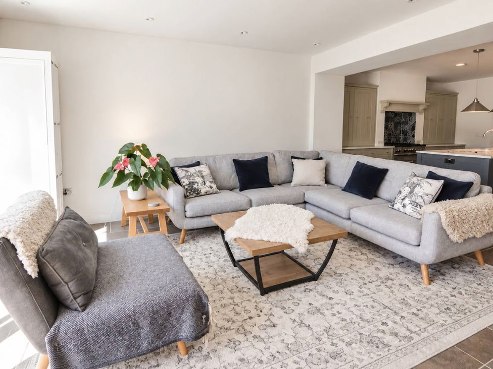 A living room with a sofa and coffee table at Rheidiol St Davids