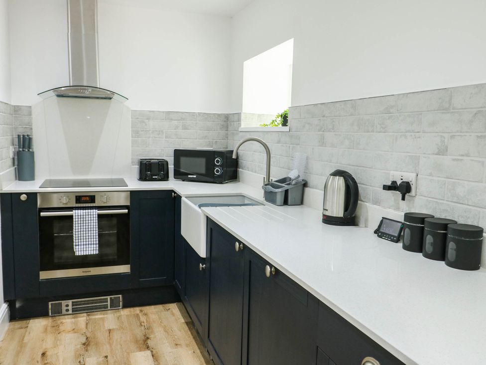 A kitchen with various appliances and fixtures at River View in Betws-y-Coed