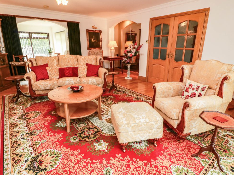 A living room with a sofa and armchair at Wallvilla 