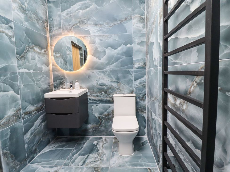 A bathroom with a sink and toilet at Cottage by the River in Burnley
