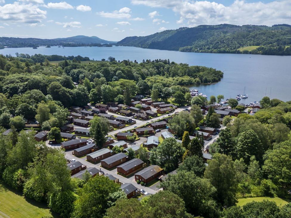 An aerial view of cabins near a lake at Fir Tree Lodge in Coniston 3, White Cross Bay near Windermere