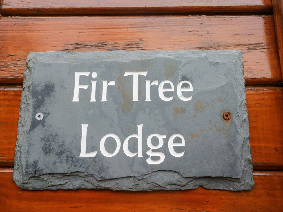 A sign displaying the name Fir Tree Lodge at Fir Tree Lodge White Cross bay on Windermere, Troutbeck Bridge