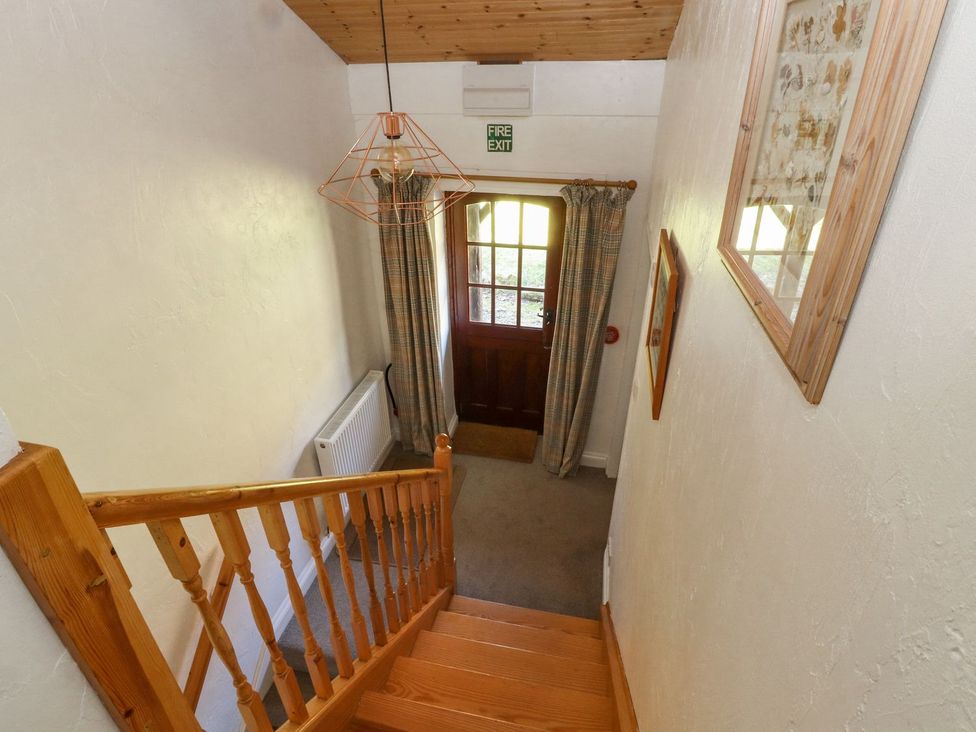 A staircase leading to an entrance with a door at Mellfell Cottage near Watermillock