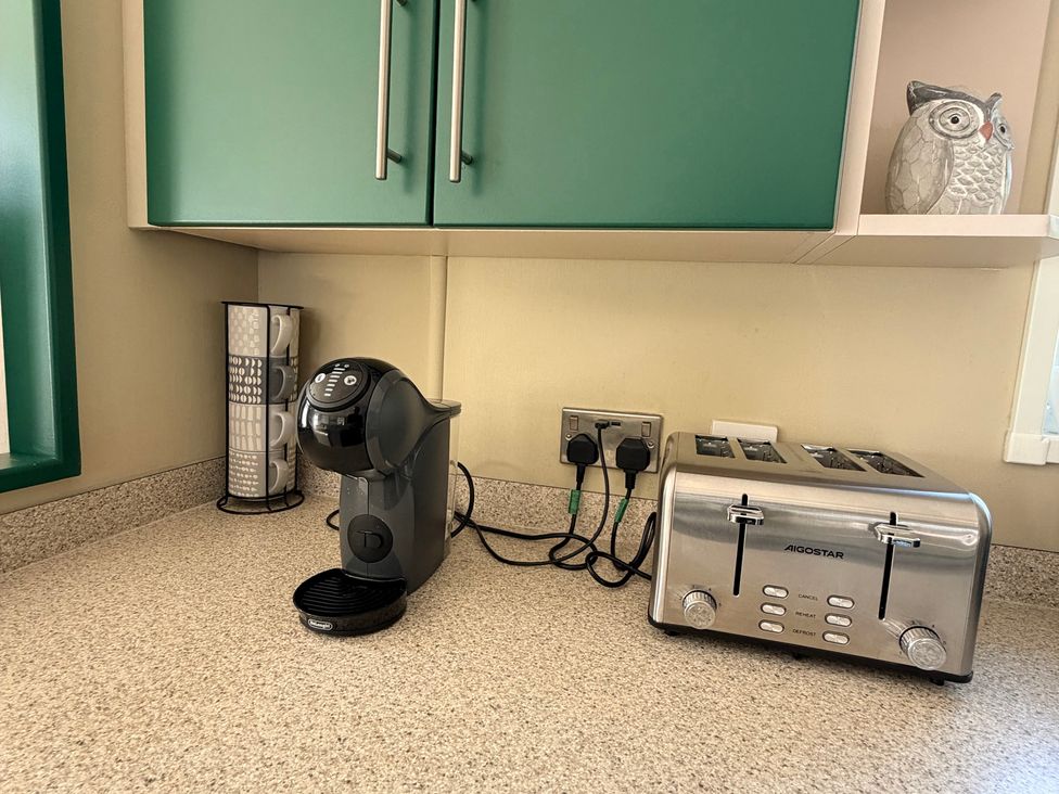 A kitchen countertop with a coffee machine and a toaster at Boutique Lodge in Cheriton Bishop