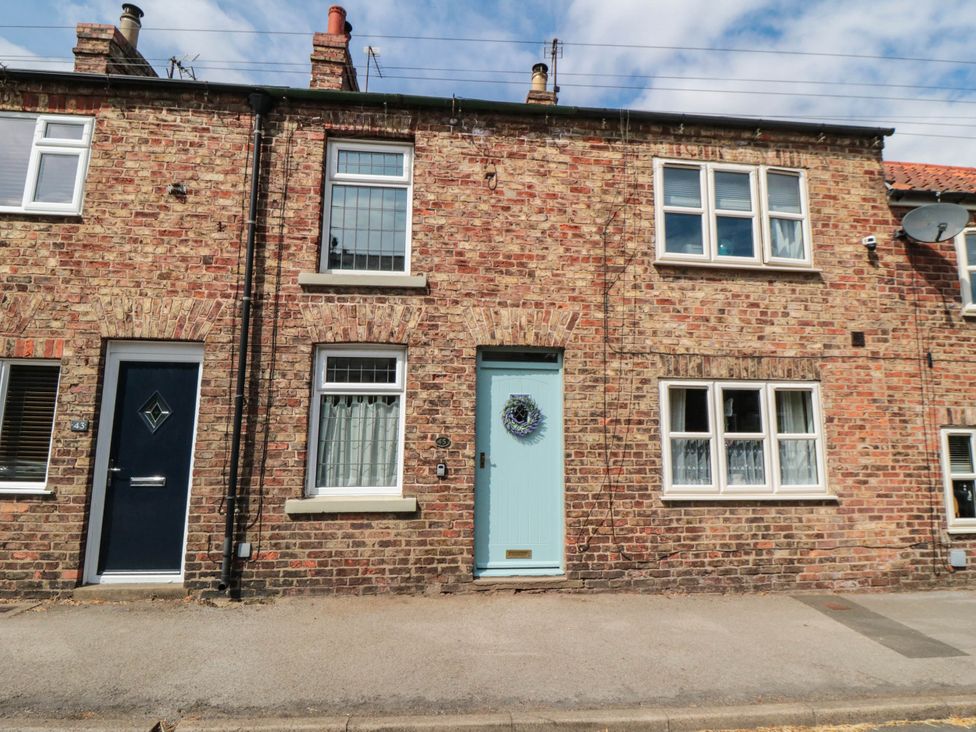 A building facade with multiple windows and doors at 45 St. Hildas Street Sherburn